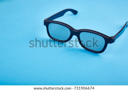 A 3D glasses on the background of a wooden table