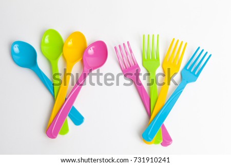 Colorful spoons on white background