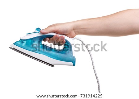 Hand of a man holding an iron on a white background isolated