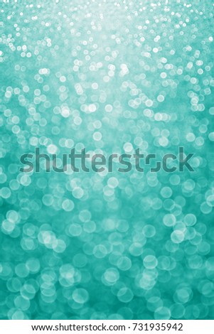 Abstract elegant teal green glitter sparkle confetti background for turquoise happy birthday party invite, aqua mint wedding banner pattern, sale poster texture or fancy Christmas card winter design Royalty-Free Stock Photo #731935942