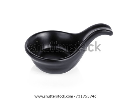 black ceramic spoon on white background