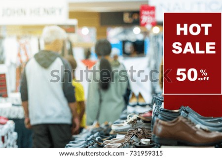 sale 50% off mock up advertise display frame setting over the men shoes shelf in the shopping department store for shopping, business fashion and advertisement concept