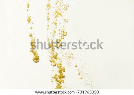 Golden fizz is isolated over a light background