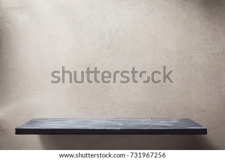 wooden shelf and grey wall background texture