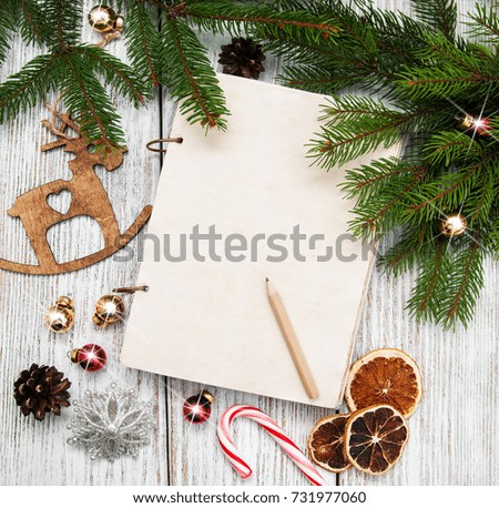 Christmas holiday background - tree  and decoration on a black stone background