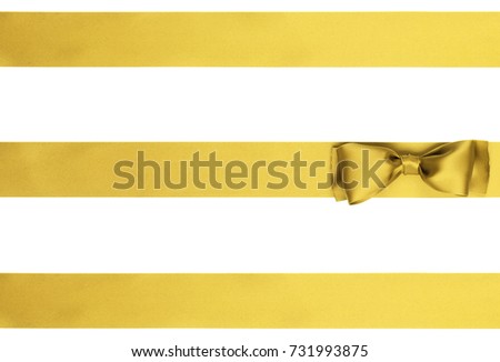 Gift golden ribbon bow with two horizontal ribbon isolated on white 