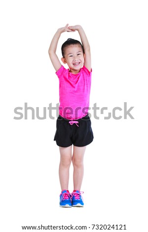 Full body of adorable asian child in sportswear doing exercise. Healthy chinese girl practicing fitness at studio. Sports and active lifestyle. Runner kid smiling happy isolated on white background.