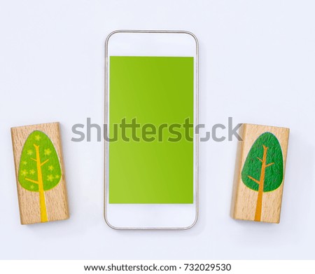 Empty phone screen with tree toy block for Environmental concept
