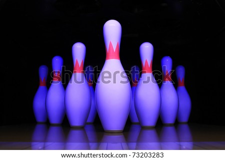 Bowling pin with a black background.