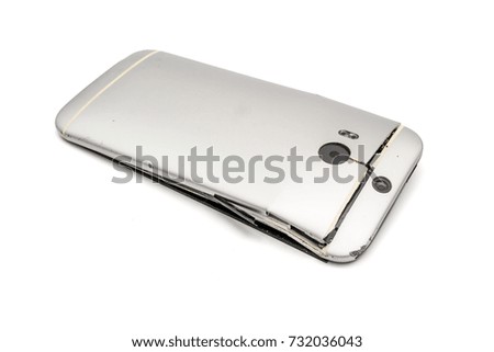 Broken mobile phone and To crack and bend.And as object and image isolated and with a white background. ( clipping path )