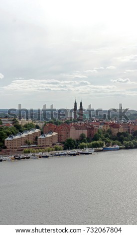 Pier with boats and cityscape from the observation deck of Town Hall, Stockholm, Sweden
