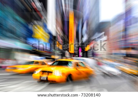 Motion blur photo of yellow taxi cabs rushing on Broadway road in Times Square during rush hour in midtown Manhattan, New York City, New York USA.Colorful abstract background. No people. Copy space