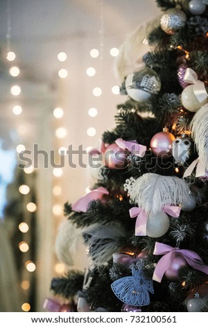 The room is decorated for Christmas and New Year in white style. 