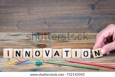 innovation. Wooden letters on the office desk. Business and communication background