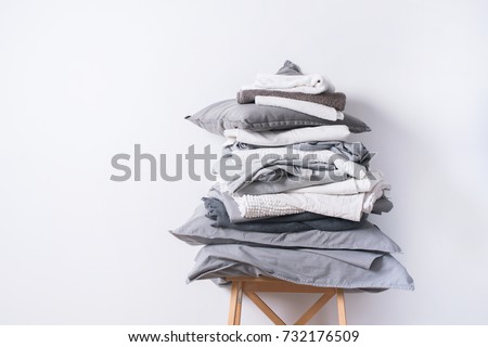stacks monochrome gradient white gray black bed linen textiles clothing background pile concept Royalty-Free Stock Photo #732176509