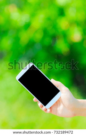 Smartphone and green background