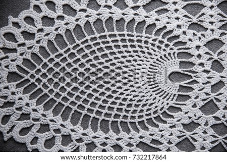 The texture of lace on a gray background