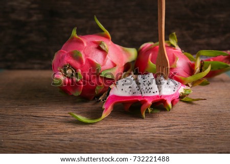Fresh dragon fruit on wood background