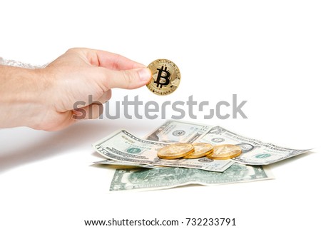 Bitcoin with hand on dollar background