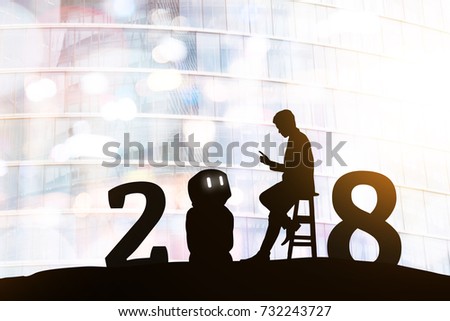 2018 years of robot assistant technology , industry 4.0 , artificial intelligence trend concept. Silhouette of business man talking to automation robo advisor. Bokeh flare light effect background. Royalty-Free Stock Photo #732243727