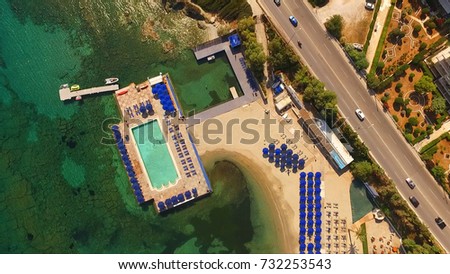 Aerial birds eye view photo taken by drone of Grand Resort Lagonissi resort with turquoise clear waters