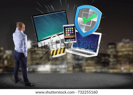 View of a Businessman in front of a wall with a Shield symbol displayed on a futuristic interface  - Technology and security concept