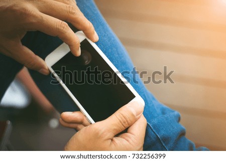 Man using smartphone in cafe. Man using smartphone black screen,copy space.