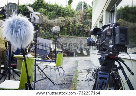 behind the scene film crew team filming movie scene on outdoor location group cinema set