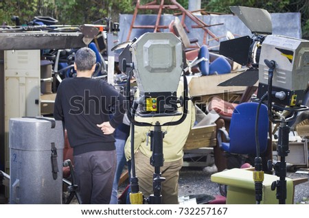 behind the scene film crew team filming movie scene on outdoor location group cinema set