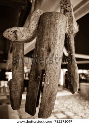 Sepia picture of vintage bell made from wood,Rural people in Thailand is hanging on the neck of cow and buffalo. 
