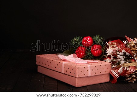 box with a gift, Christmas decorations on a black background, new year                               