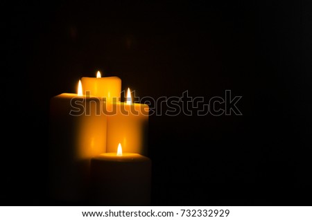 Fire candle on dark black background