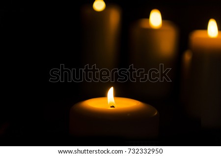 Fire candle on dark black background