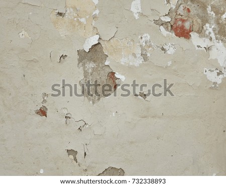 Beige and Gray Dirty Plaster Wall, With Falling Off Flakes Of Paint. Rough Surface. Old Weathered Painted  Background Texture. Vintage Timber Background. Peeled Plaster Brickwall