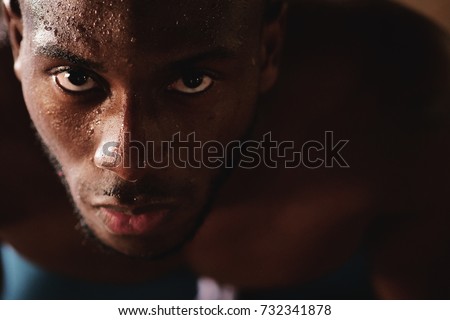 Portrait of a sweaty and muscular man breathing hard on the hard work just finished. Concept of: breathing, workout, gym and workout and fatigue. Royalty-Free Stock Photo #732341878