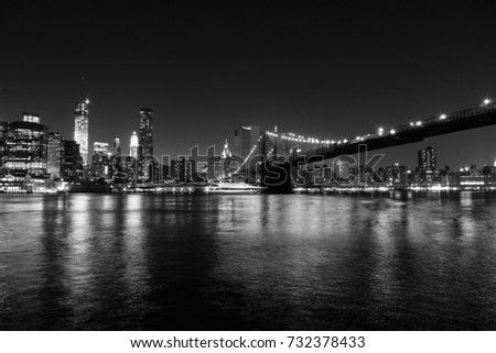 New York City night lights - Manhattan skyline from Brooklyn. Black and white retro style.