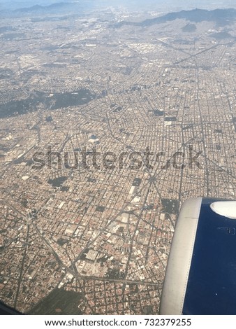 Window seat on airplane overlooking Mexico City