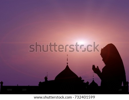 Silhouette women muslim  praying Religion In the evening sun Shine