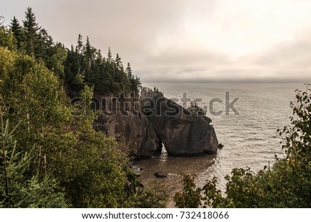 Sunrise at famous Hopewell Rocks geologigal formations at low tide biggest tidal wave Fundy Bay New Brunswick Canada