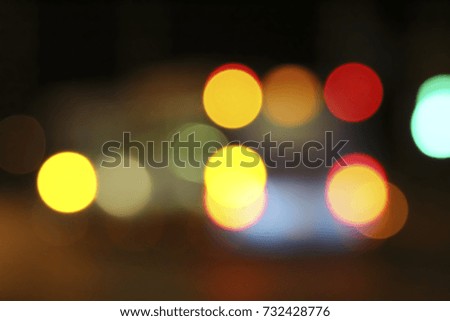 Abstract defocused background with red-orange spots of light