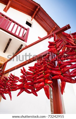 Red peppers drying under the sun. Espelette - Basque Country - France Royalty-Free Stock Photo #73242955