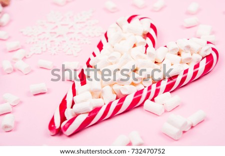 Christmas candy on pink background