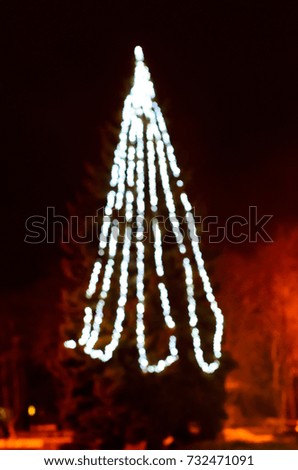 Blurred abstract silhouette of the Christmas tree