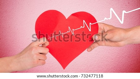 Digital composite of Heart beat over hands holding heart