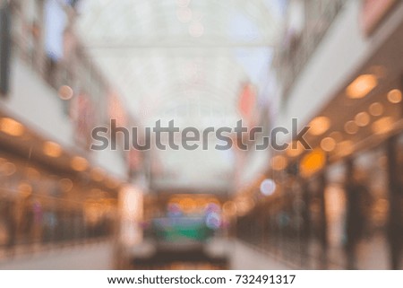 Blurred mall center space with windows shops
