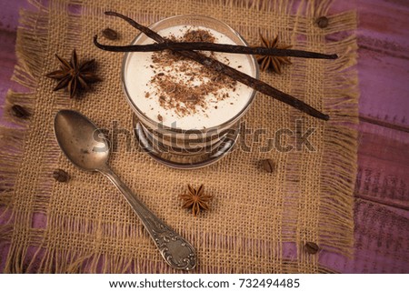 Coffee, milk choko pudding on wooden background
