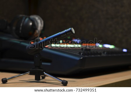 desktop microphone on background of sound mixer