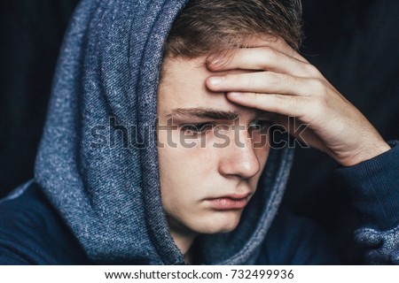 Portrait of a sad, tired, depressed teenager. Problems of teenagers, concept Royalty-Free Stock Photo #732499936
