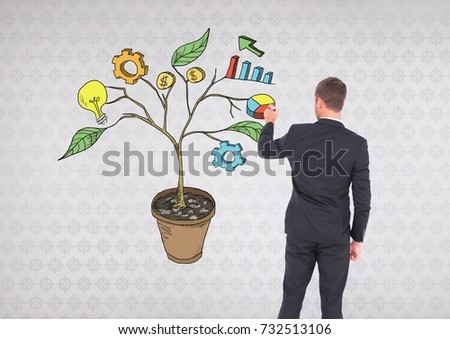 Digital composite of Man holding pen and Drawing of Business graphics on plant branches on wall