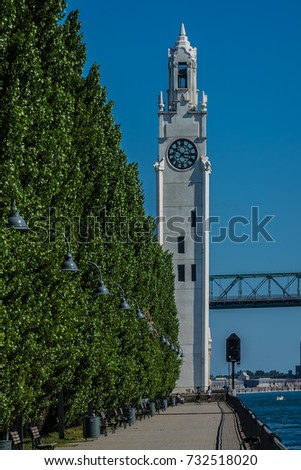 Clock Tower (Quai de l'Horloge), St Lawrence River and Jacques Cartier Bridge at Old Port. Montreal, Quebec, Canada.